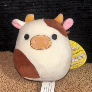 5 inch brown and white cow named Ronnie!